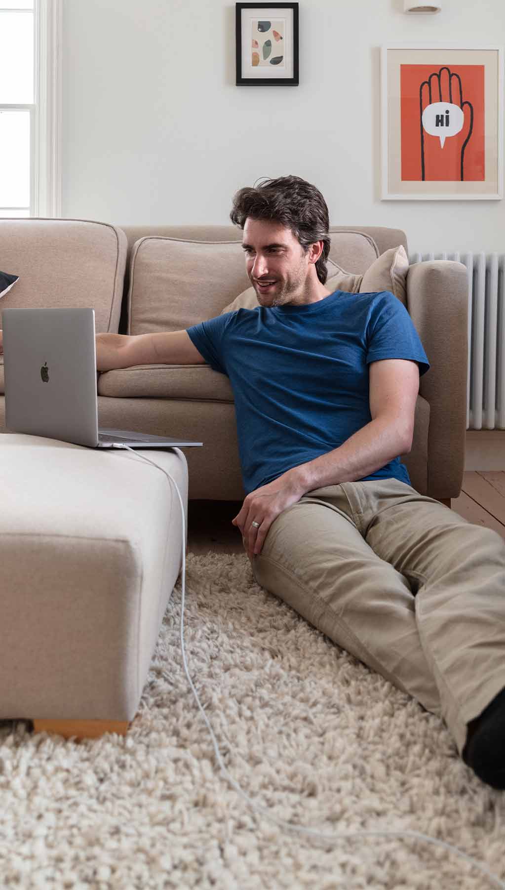 Man in lounge using laptop