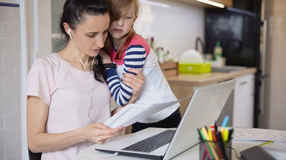 Image of a mother and daughter looking at a laptop