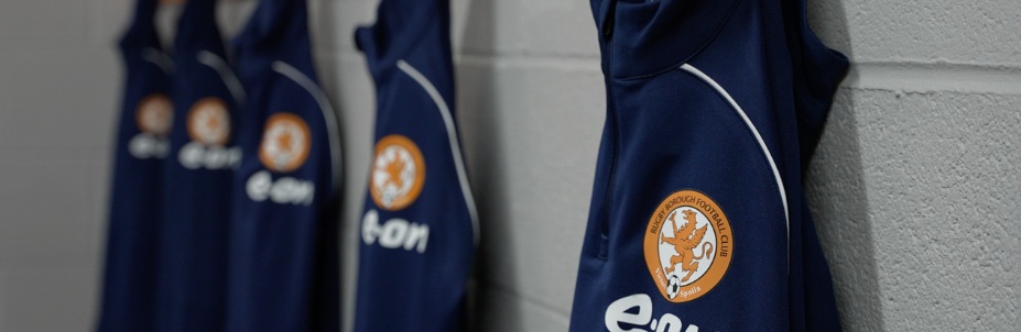 E.ON branded training shirts hung up on row of pegs