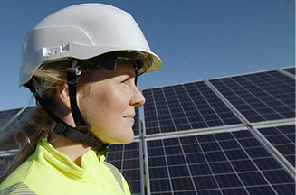 worker infront of solar panels